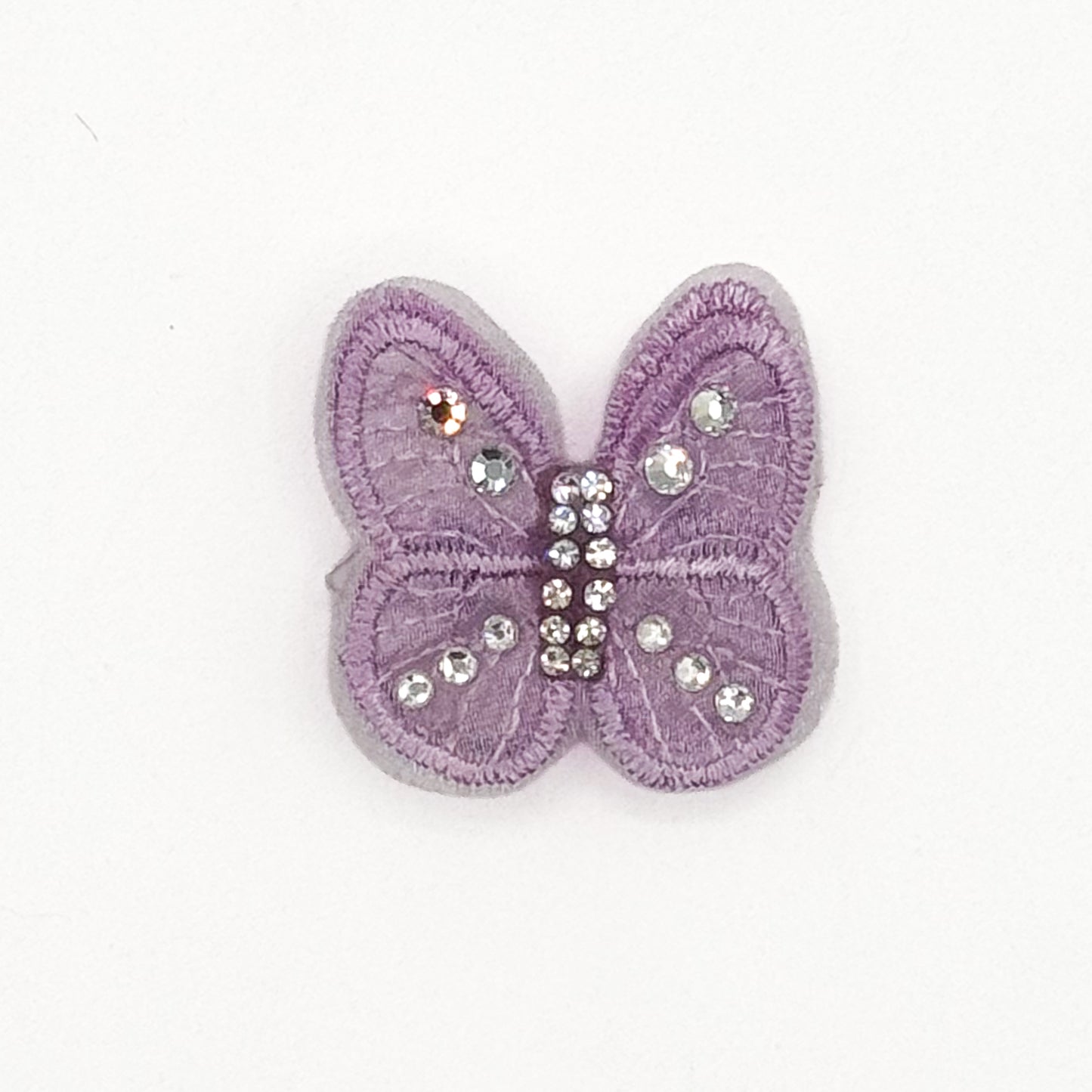 Fermaglio a farfalla lilla con cristalli sulle ali per cani piccoli