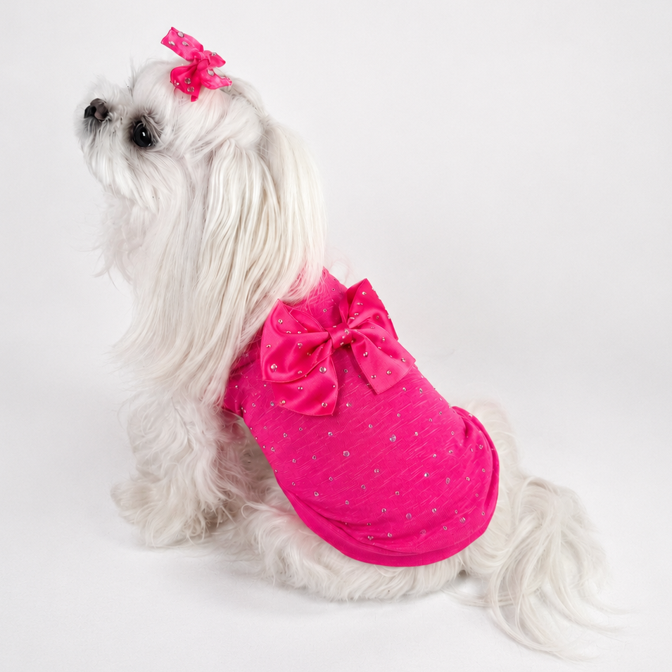 T-shirt fucsia in misto stretch con retro interamente ricoperto da cristalli aurora boreale e fiocco in raso