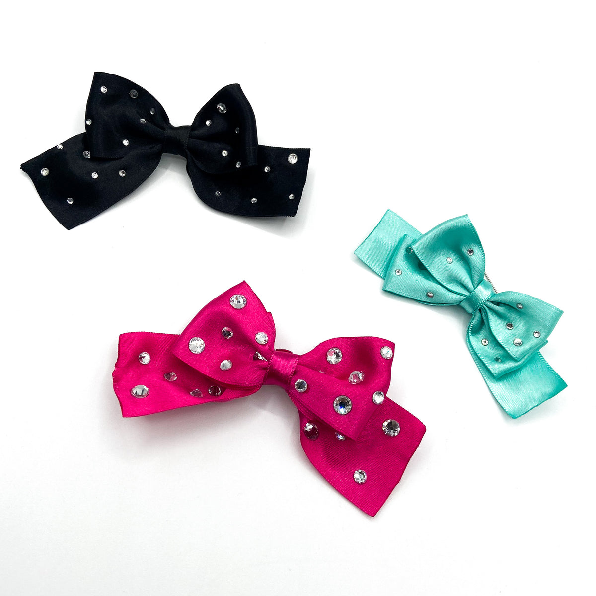 Tre fiocchi in raso con strass: nero, fucsia e turchese